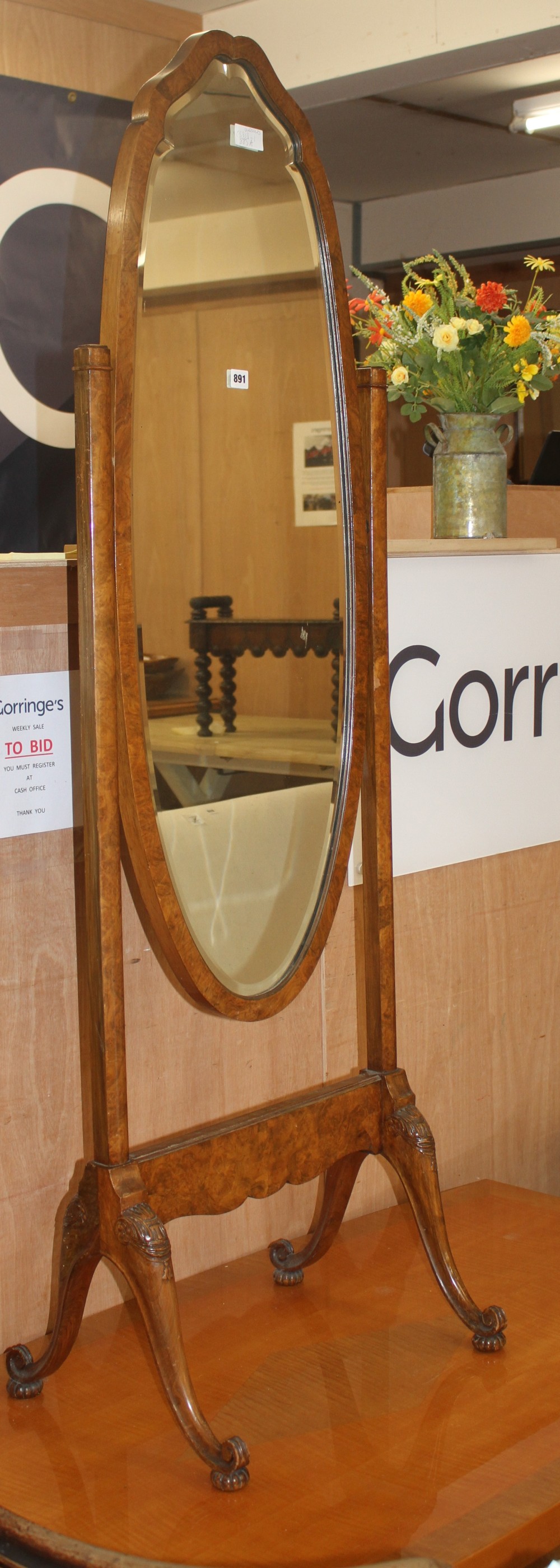 A walnut cheval mirror and a satin maple coffee table, L.150cm D.81cm H.41cm